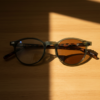Ida Brown Photochromic Lens Glasses - Green Round TR90 Frame - Lifestyle Ida Brown Photochromic Lens Glasses - Green Round TR90 Frame