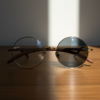 Jo Grey Photochromic Lens Glasses - Gold Round Metal Frame - Lifestyle Jo Grey Photochromic Lens Glasses - Gold Round Metal Frame