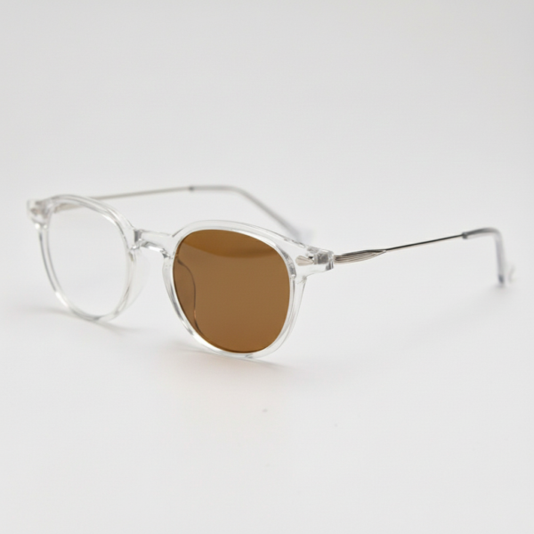 Lora Brown Photochromic Lens Glasses - Clear Round TR90 Frame - Side View Lora Brown Photochromic Lens Glasses - Clear Round TR90 Frame