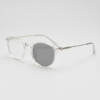 Lora Grey Photochromic Lens Glasses - Clear Round TR90 Frame - Side View Lora Grey Photochromic Lens Glasses - Clear Round TR90 Frame