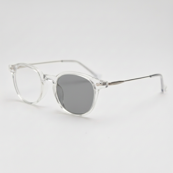 Lora Grey Photochromic Lens Glasses - Clear Round TR90 Frame - Side View Lora Grey Photochromic Lens Glasses - Clear Round TR90 Frame