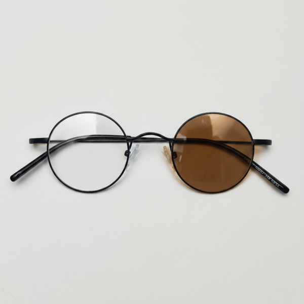 LVY Brown Photochromic Lens Glasses - Matte black Round Titanium Frame - Front View LVY Brown Photochromic Lens Glasses - Matte black Round Titanium Frame