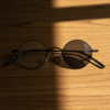 LVY Grey Photochromic Lens Glasses - Matte black Round Titanium Frame - Lifestyle LVY Grey Photochromic Lens Glasses - Matte black Round Titanium Frame
