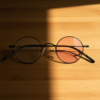 LVY Pink Photochromic Lens Glasses - Matte black Round Titanium Frame - Lifestyle LVY Pink Photochromic Lens Glasses - Matte black Round Titanium Frame