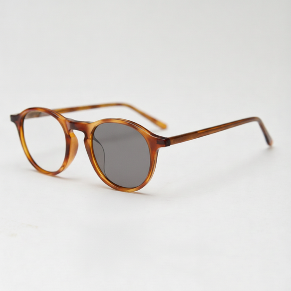 Moira Grey Photochromic Lens Glasses - Tortoise Round TR90 Frame - Side View Moira Grey Photochromic Lens Glasses - Tortoise Round TR90 Frame